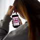 A person looks at information about mifepristone, a medication used to end pregnancy, on their phone.